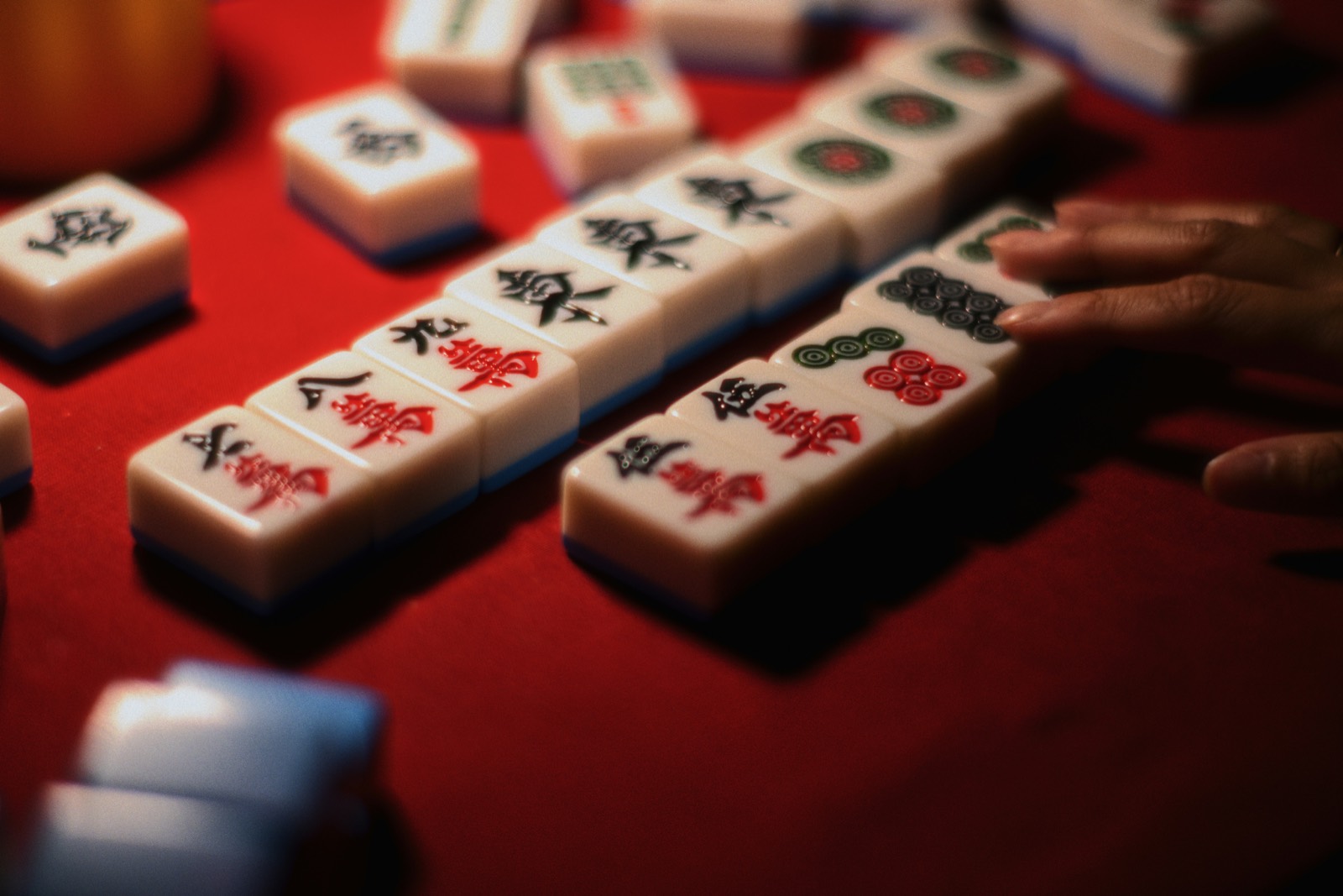 Mahjong tiles on red felt